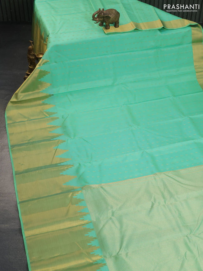 Pure kanchipuram silk saree teal green shade with allover zari woven 1000 buttas and temple design long zari woven border