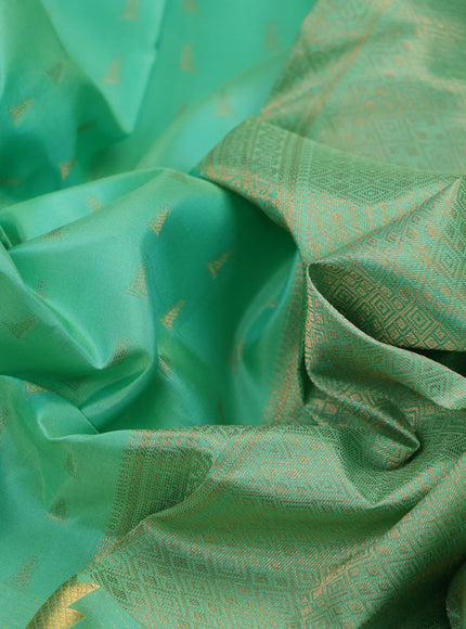 Pure kanchipuram silk saree teal green shade with allover zari woven 1000 buttas and temple design long zari woven border