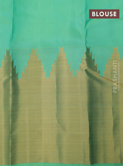 Pure kanchipuram silk saree teal green shade with allover zari woven 1000 buttas and temple design long zari woven border