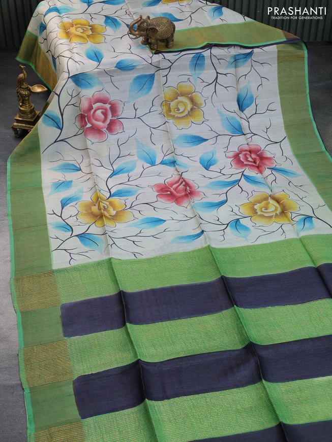 Pure tussar silk saree off white and green shade with floral hand painted prints and zari woven border