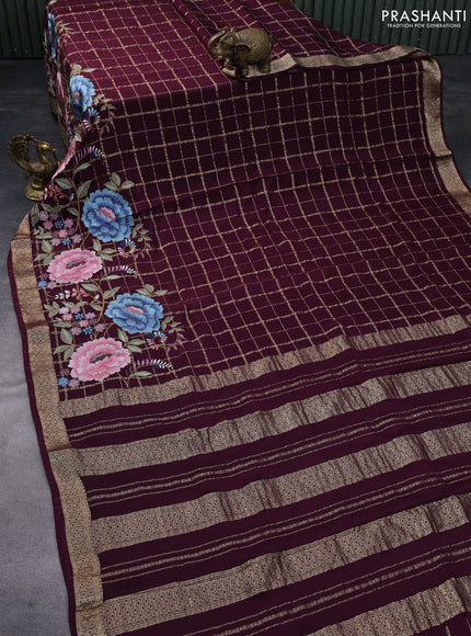 Pure crepe saree wine shade with allover zari checks & floral deisgn embroidery work and zari woven border