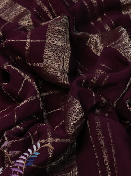 Pure crepe saree wine shade with allover zari checks & floral deisgn embroidery work and zari woven border