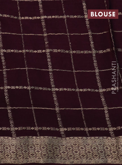 Pure crepe saree wine shade with allover zari checks & floral deisgn embroidery work and zari woven border