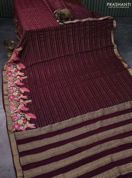 Pure crepe saree maroon with allover zari weaves & embroidery work and zari woven border