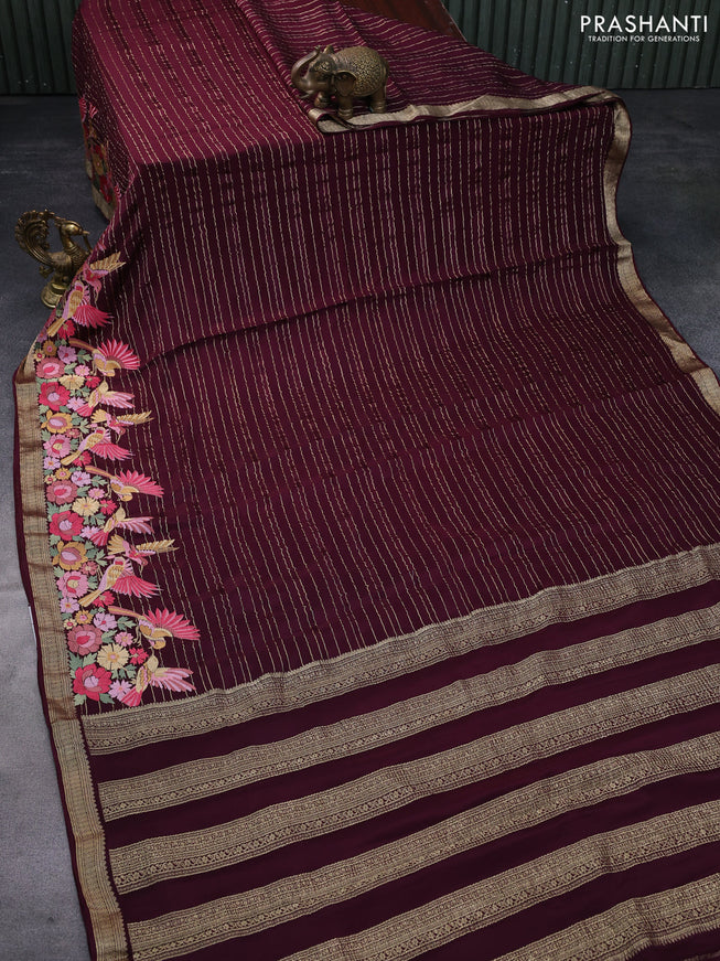 Pure crepe saree maroon with allover zari weaves & embroidery work and zari woven border