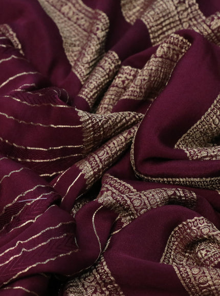 Pure crepe saree maroon with allover zari weaves & embroidery work and zari woven border