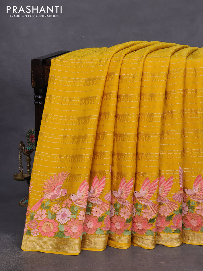 Pure crepe saree mustard yellow with allover zari weaves & embroidery work and zari woven border