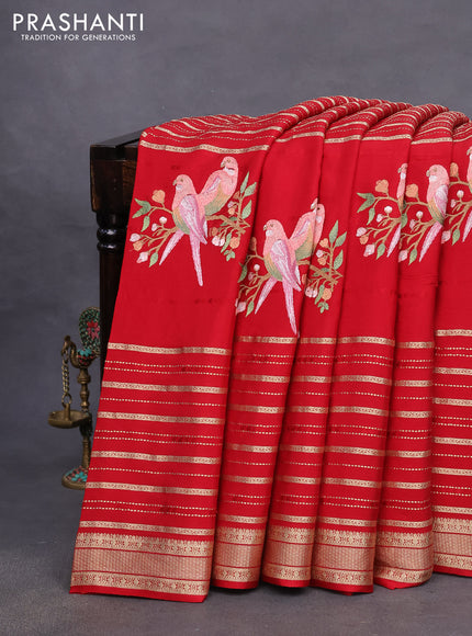 Pure crepe saree red with allover zari weaves & embroidery work and zari woven border