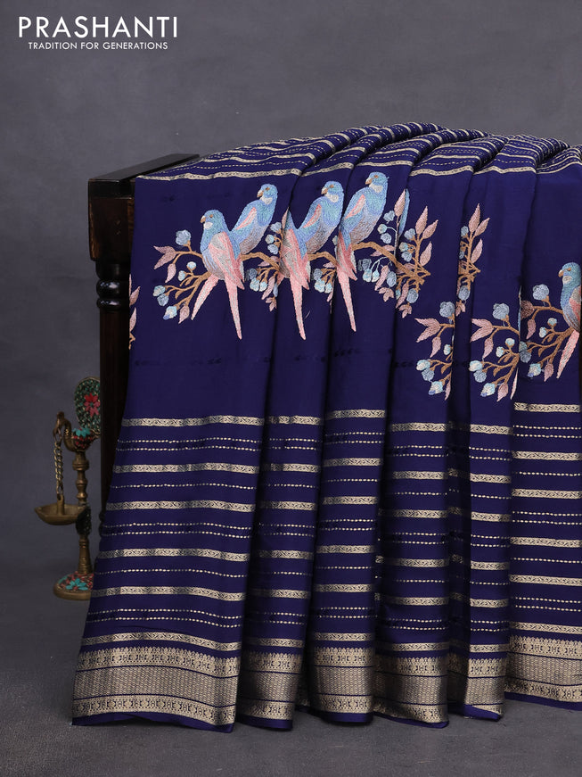 Pure crepe saree blue with allover zari weaves & embroidery work and zari woven border