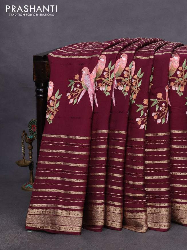 Pure crepe saree wine shade with allover zari weaves & embroidery work and zari woven border