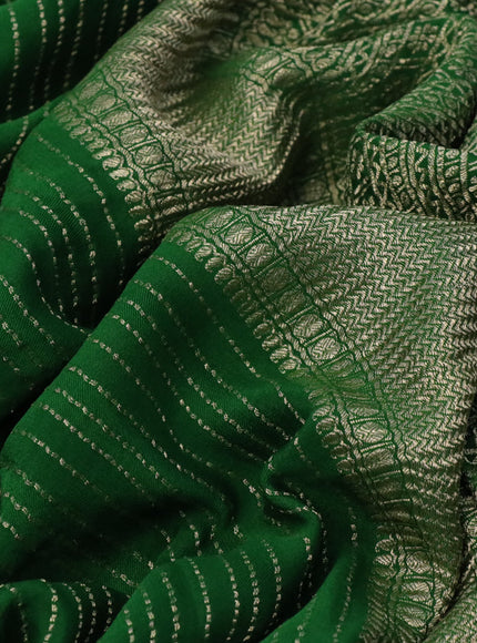 Pure crepe saree green with allover zari weaves & embroidery work and zari woven border