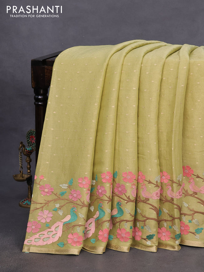 Pure georgette tissue saree pista green with zari woven buttas and floral deisgn embroidery work border