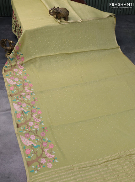 Pure georgette tissue saree pista green with zari woven buttas and floral deisgn embroidery work border