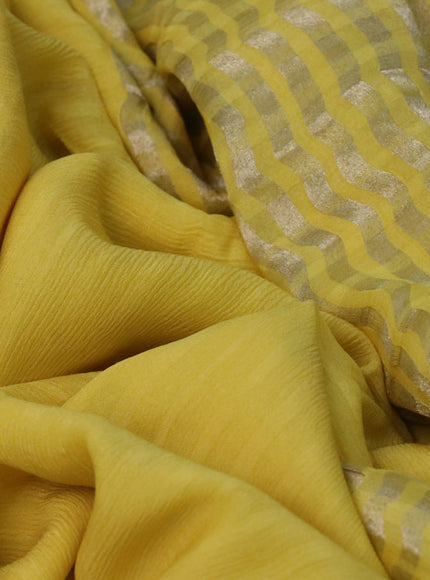 Pure georgette saree yellow with plain body and rettapet zari woven embroidery work border