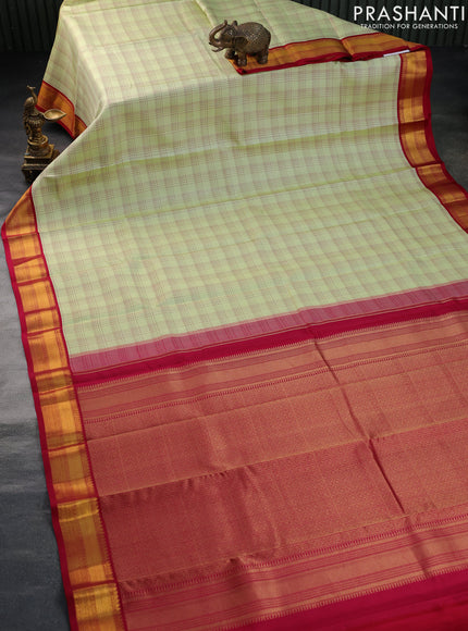 Pure kanchipuram silk saree pista green and pink with allover checked pattern and zari woven korvai border