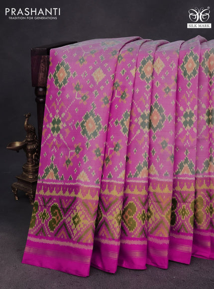 Rajkot patola silk saree light pink and pink with allover ikat weaves and zari woven ikat border