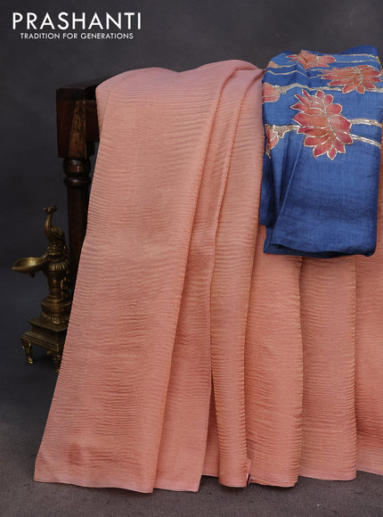 Organza crushed tissue silk saree pastel peach orange and blue with plain body in borderless style