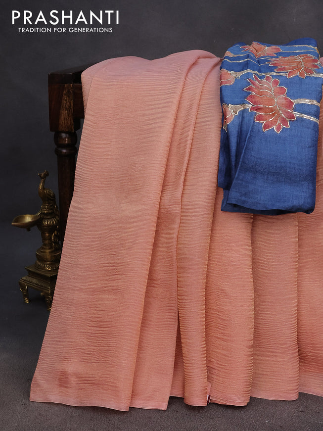 Organza crushed tissue silk saree pastel peach orange and blue with plain body in borderless style