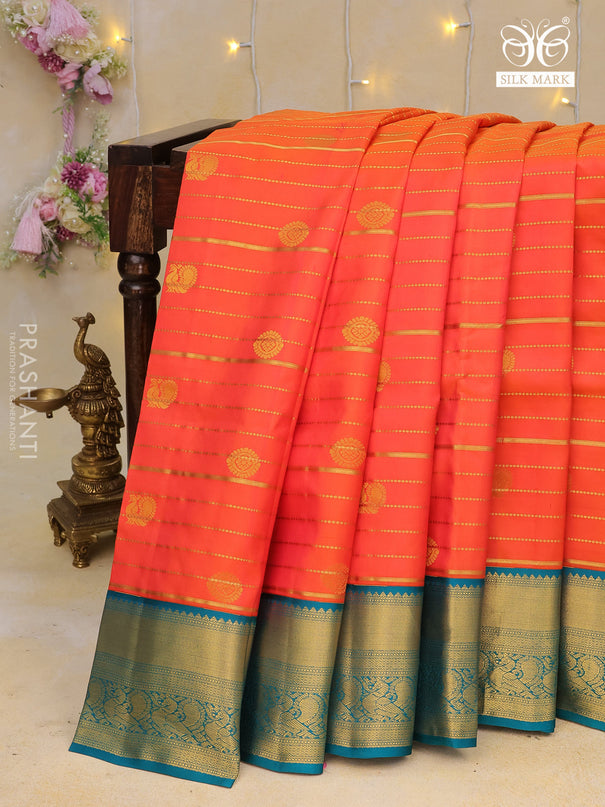 Pure kanchipuram silk saree orange and cs blue with allover zari weaves & buttas and annam zari woven korvai border