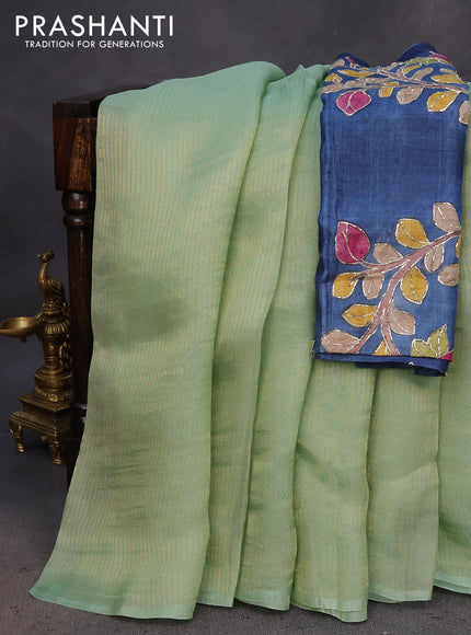 Organza crushed tissue silk saree pastel green with allover zari weaves in borderless style