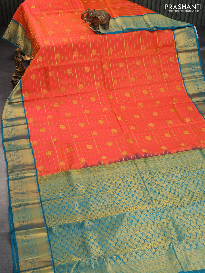 Pure kanchipuram silk saree orange and cs blue with allover zari weaves & buttas and annam zari woven korvai border