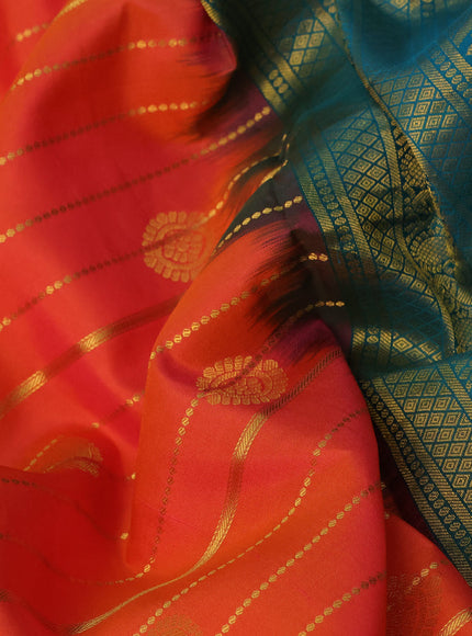 Pure kanchipuram silk saree orange and cs blue with allover zari weaves & buttas and annam zari woven korvai border