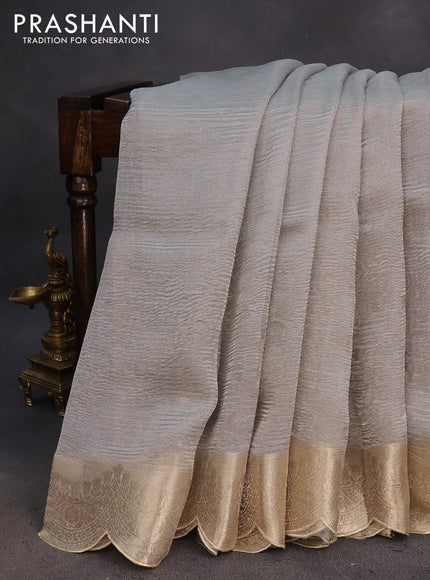 Organza crushed tissue silk saree grey shade with plain body and zari woven border