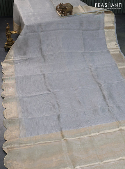 Organza crushed tissue silk saree grey shade with plain body and zari woven border