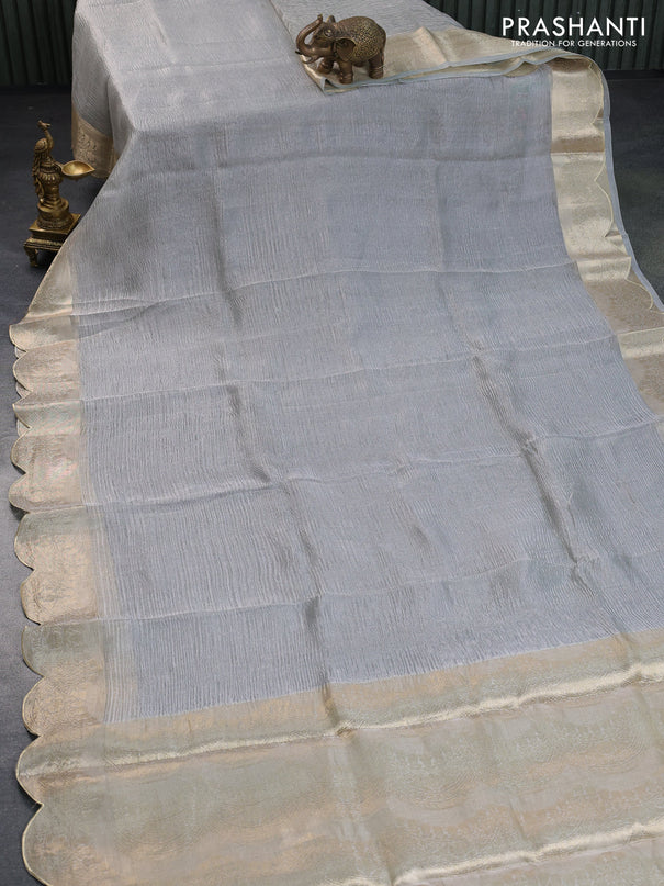 Organza crushed tissue silk saree grey shade with plain body and zari woven border