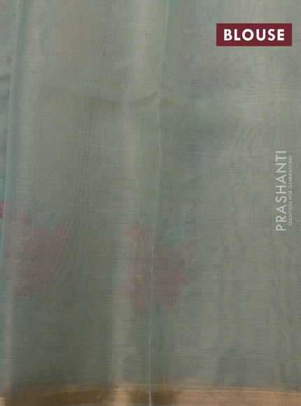 Pure organza tissue silk saree pastel green shade with floral embroidery work buttas and zari woven border