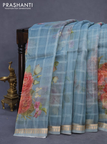 Pure organza silk saree pastel blue shade with allover checked pattern & floral digital prints and zari woven border