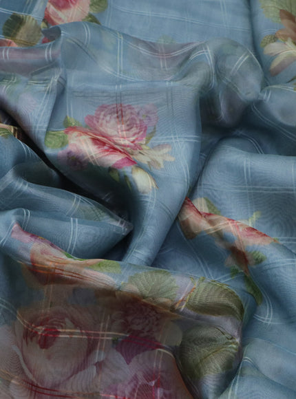 Pure organza silk saree pastel blue shade with allover checked pattern & floral digital prints and zari woven border