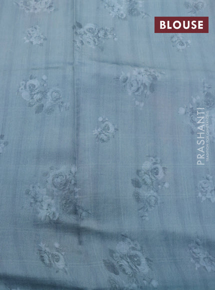 Pure organza silk saree pastel blue shade with allover checked pattern & floral digital prints and zari woven border