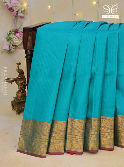 Pure kanchipuram silk saree teal blue and pink with allover self emboss and zari woven border