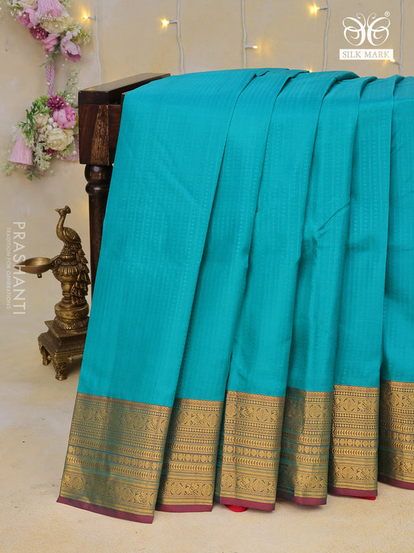 Pure kanchipuram silk saree teal blue and pink with allover self emboss and zari woven border