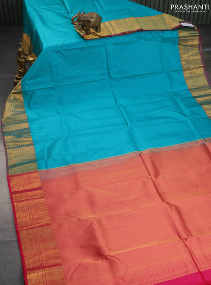 Pure kanchipuram silk saree teal blue and pink with allover self emboss and zari woven border