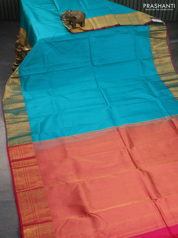 Pure kanchipuram silk saree teal blue and pink with allover self emboss and zari woven border