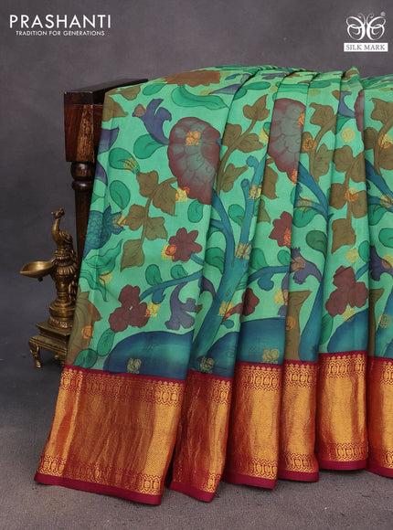 Pure kanchipuram silk saree green and dark magenta pink with allover pen kalamkari hand painted prints & zari buttas and rich zari woven korvai border