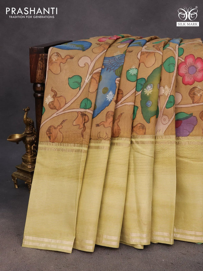 Pure kanchipuram silk saree sandal and pista green with allover pen kalamkari hand painted prints and long silver zari woven border