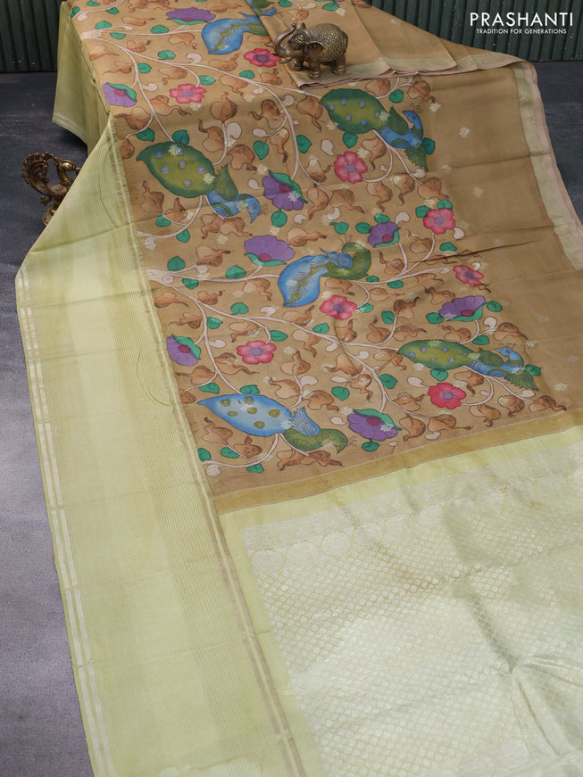 Pure kanchipuram silk saree sandal and pista green with allover pen kalamkari hand painted prints and long silver zari woven border