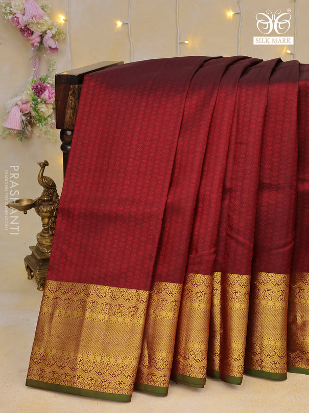 Pure kanchipuram silk saree deep maroon and green with allover self emboss and zari woven border