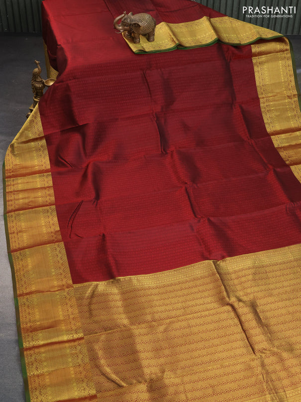 Pure kanchipuram silk saree deep maroon and green with allover self emboss and zari woven border