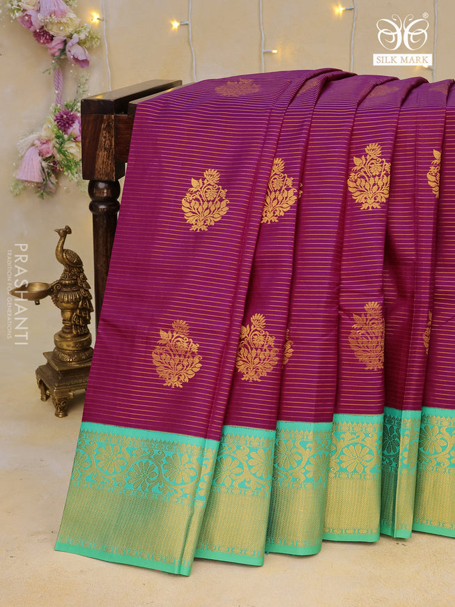 Pure kanchipuram silk saree purple and teal green shade with allover zari strips & buttas and floral zari woven korvai border