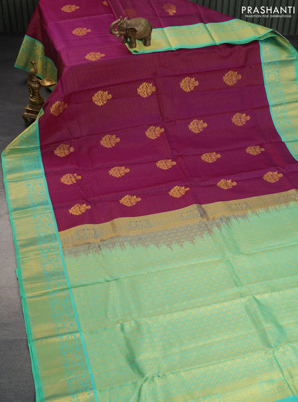 Pure kanchipuram silk saree purple and teal green shade with allover zari strips & buttas and floral zari woven korvai border