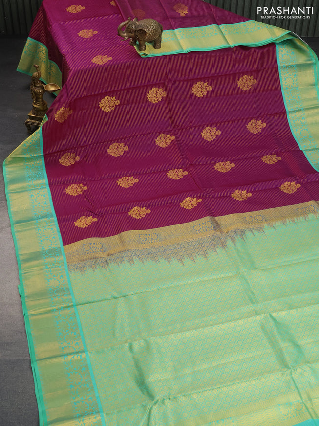 Pure kanchipuram silk saree purple and teal green shade with allover zari strips & buttas and floral zari woven korvai border