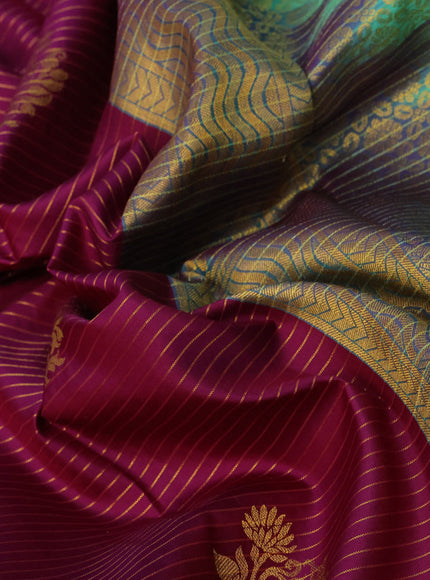 Pure kanchipuram silk saree purple and teal green shade with allover zari strips & buttas and floral zari woven korvai border