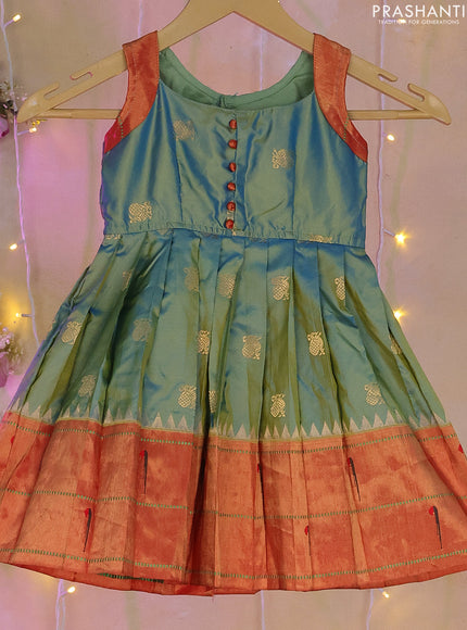 Silk kids frock dual shade of teal blue and red with patch work neck pattern and paithani butta border for 0-1 years