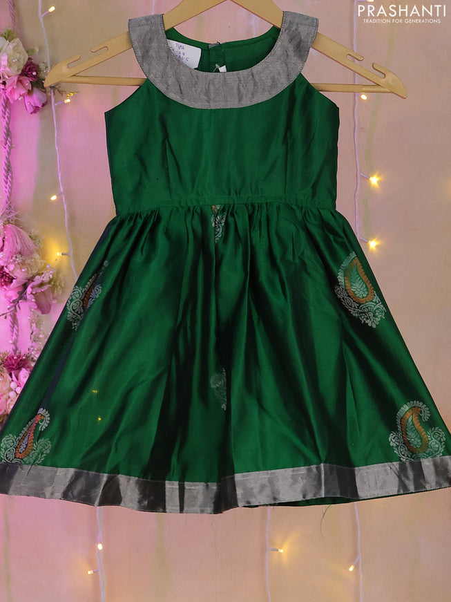 Silk kids frock green with simple patch work neck pattern and silver zari border for 0-1 years