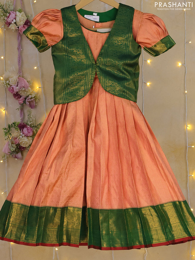 Silk kids frock peach orange and green with allover zari weaves and zari woven border for 3-4 years