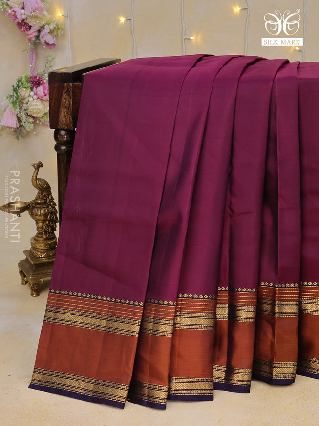 Pure kanchipuram silk saree dark magenta and navy blue with plain body and rettapet long zari woven border